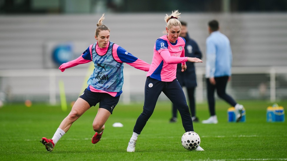 MIDFIELD BATTLE : Miedema and Laura Coombs compete for the ball