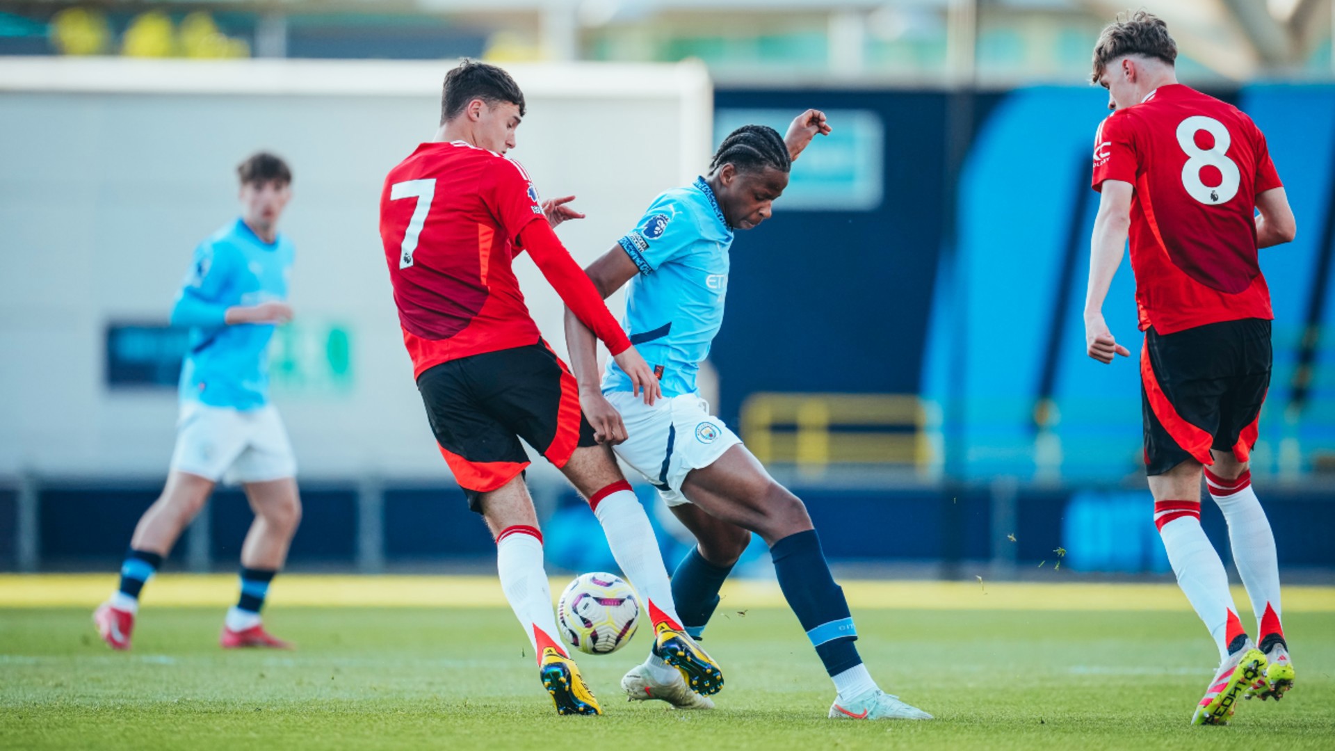 MIGHTY MFUNI : Stephen Mfuni puts a tackle in on James Scanlon.