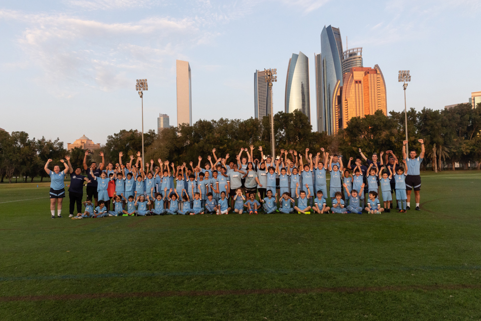 COME ON CITY : Participants at City Football Schools, Abu Dhabi, celebrate with Young Leaders