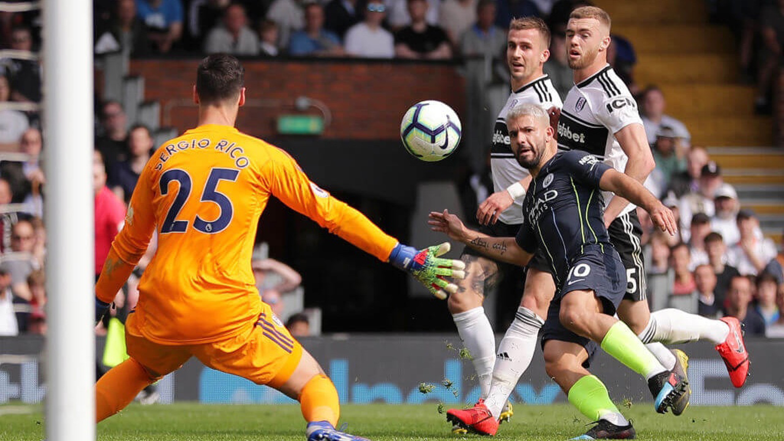 LIFT-OFF: Sergio Aguero places the ball over Rico to double City's lead