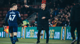 PEP TALK: The boss passes on instructions from the touchline.