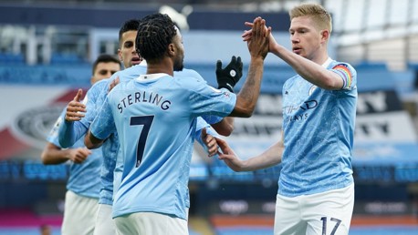 SHARE THE LOVE: The players flock to Sterling to congratulate him after the opener.