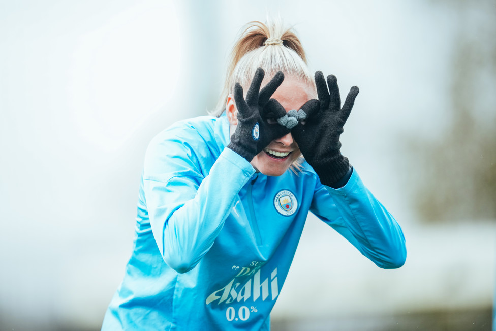 GUESS WHO  : Houghton covers her eyes.