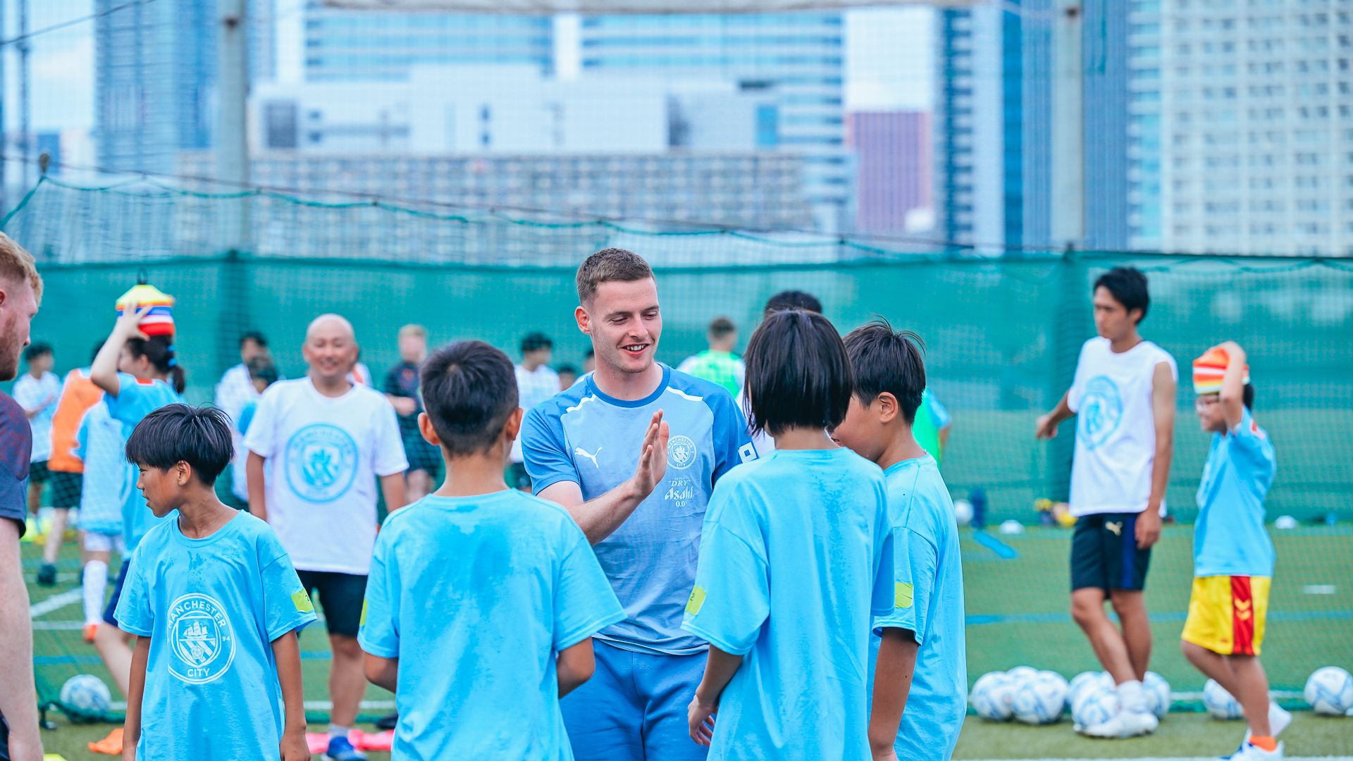 A DAY TO REMEMBER: Sergio Gomez exchanges greetings with some of the children at Friday's session.