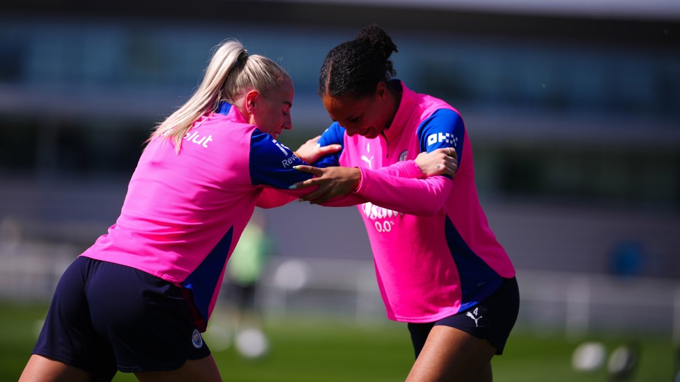 Alex Greenwood and Jade Rose in friendly combat