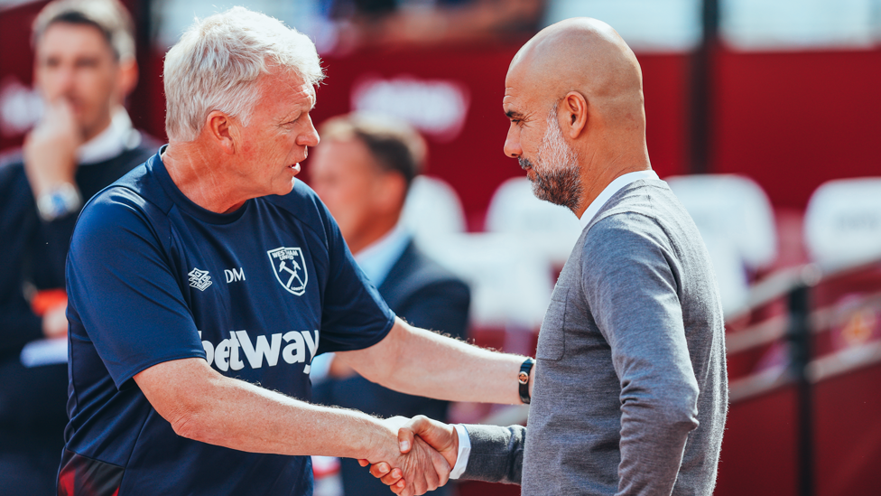 BOSSES : Guardiola and Moyes share a handshake ahead of kick-off.