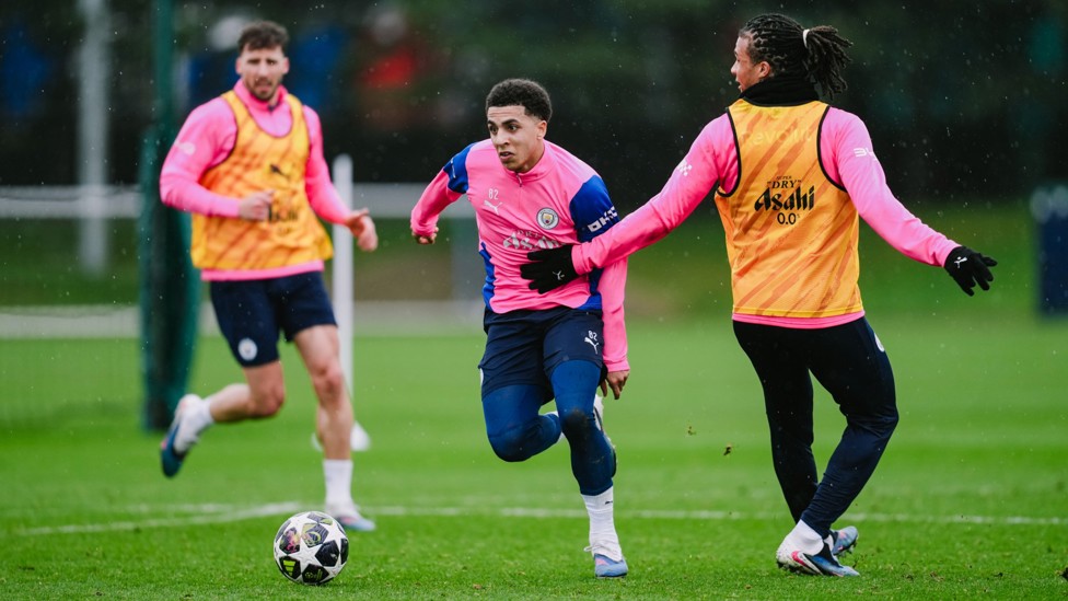 RACING RICO : Rico Lewis evades the challenge of Nathan Ake as he bursts forward