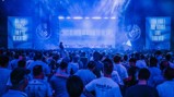 A large crowd of Manchester City fans in a concert-like setting with banners displaying celebratory messages like 'This is how it feels to be City'.