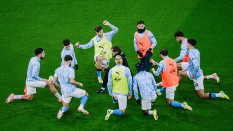 GET LOOSE: The players go through their pre-match drills.