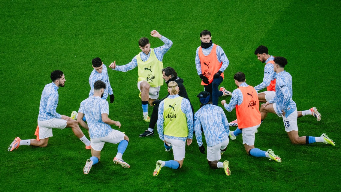 GET LOOSE: The players go through their pre-match drills.