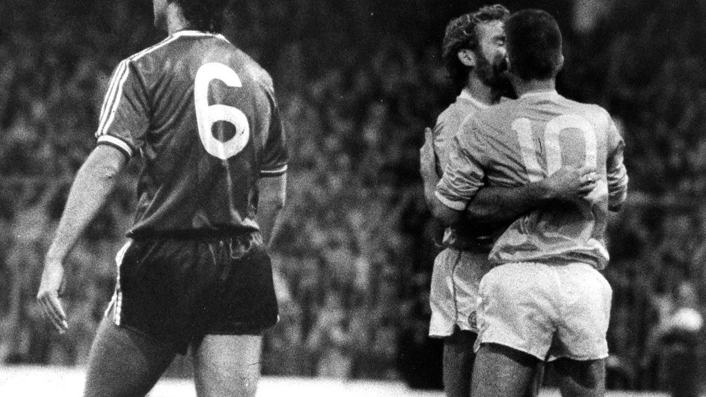 Moulden (No.10) is congratulated by Tony Grealish after another goal