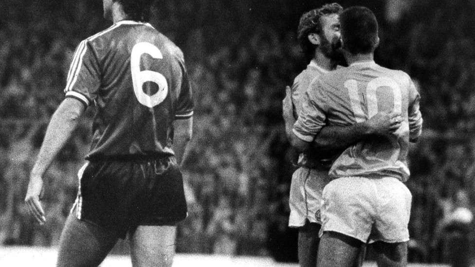 Moulden (No.10) is congratulated by Tony Grealish after another goal