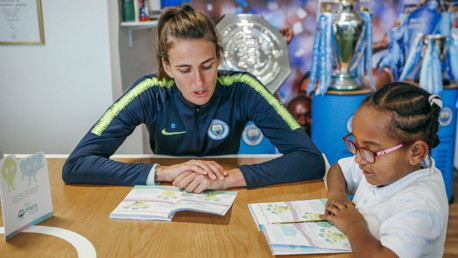 HELPING HAND: Jill Scott works through the myHappymind booklet with a pupil from a local primary school