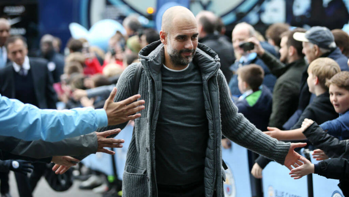 BOSS MAN: Pep arrives at the Etihad to a rapturous reception. 