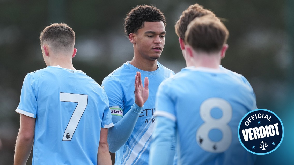 Players in Manchester City jerseys, numbered 7 and 8, wearing light blue kits with a logo indicating a team association.