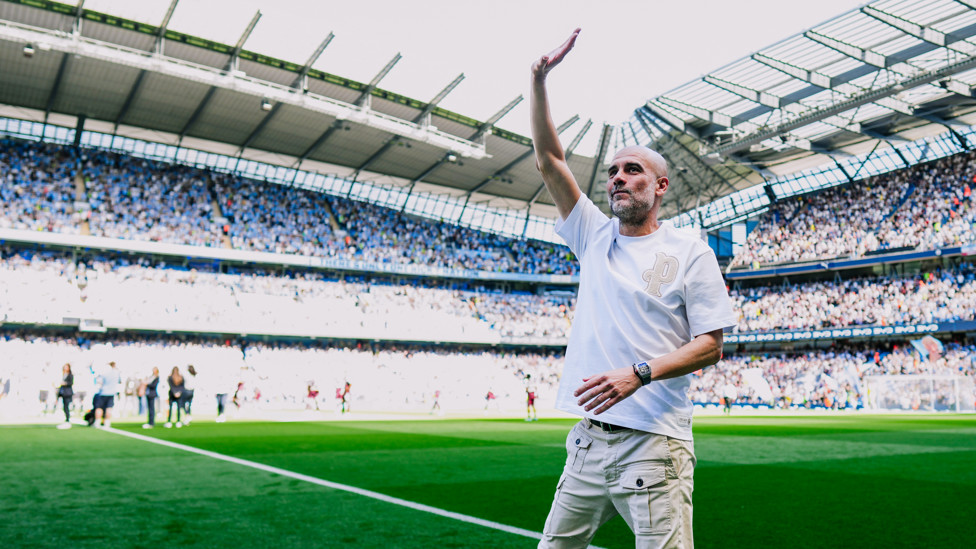 BOSS  : Pep Guardiola starts an emotional day by waving to City fans ahead of kick-off.
