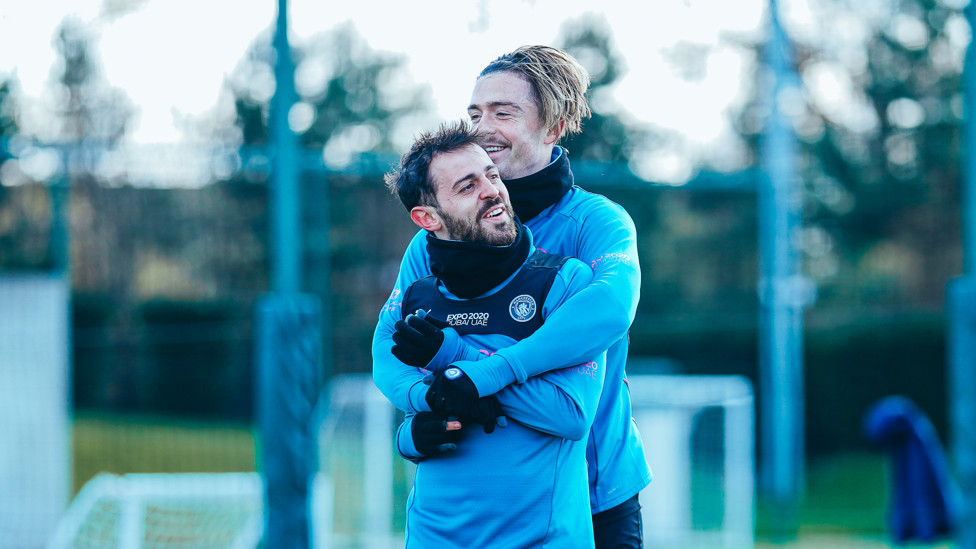 TOUCH TIGHT : Bernardo Silva and Jack Grealish share a cuddle