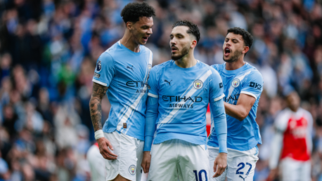 Players wearing Manchester City kit during a match, Etihad Airways sponsor visible.