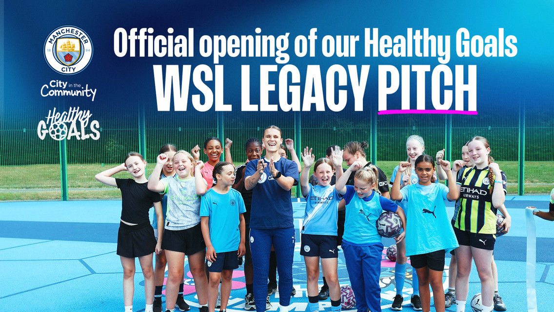 Group of young footballers and a coach standing on a blue sports pitch with Manchester City community logos. Text reads 'Official opening of our Healthy Goals WSL Legacy Pitch.'
