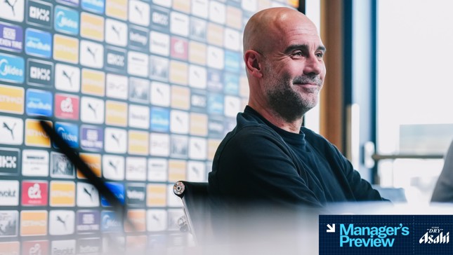 A man in a black sweater is at a press conference, seated in front of a sponsorship board featuring multiple logos. The text 'Manager's Preview' and 'Asahi Super Dry' appear in the bottom right corner.