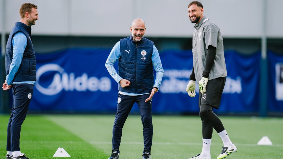 ALL SMILES: Pep Guardiola and Gianluigi Donnarumma share a laugh