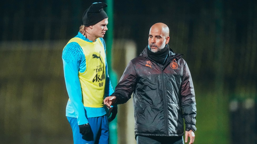 PEP TALK : The manager deep in discussion with star striker, Erling Haaland