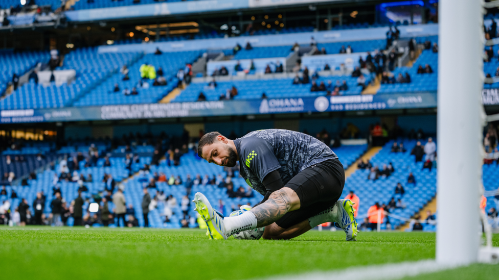 GET LOOSE : Donnarumma goes through his pre-match routine.