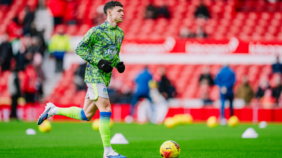 PHIL-ING GOOD : Foden gets in the mood during the pre-match warm up.