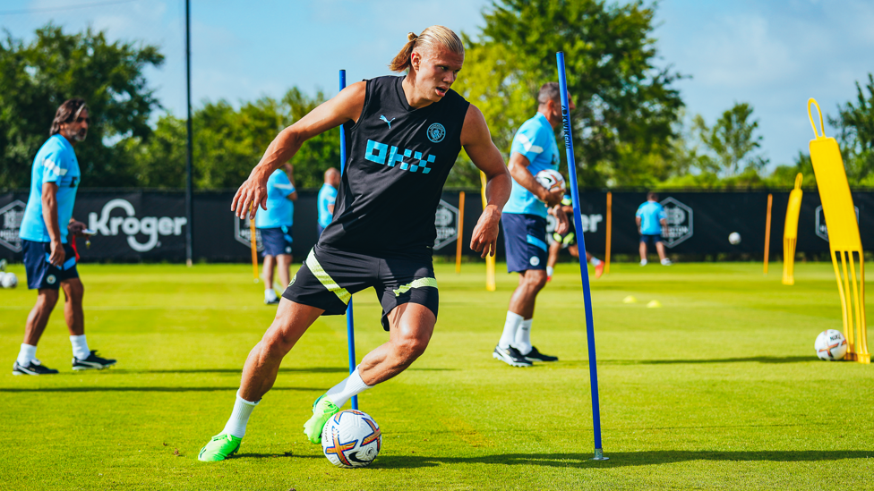 CLOSE CONTROL : Erling Haaland works his way through the obstacles