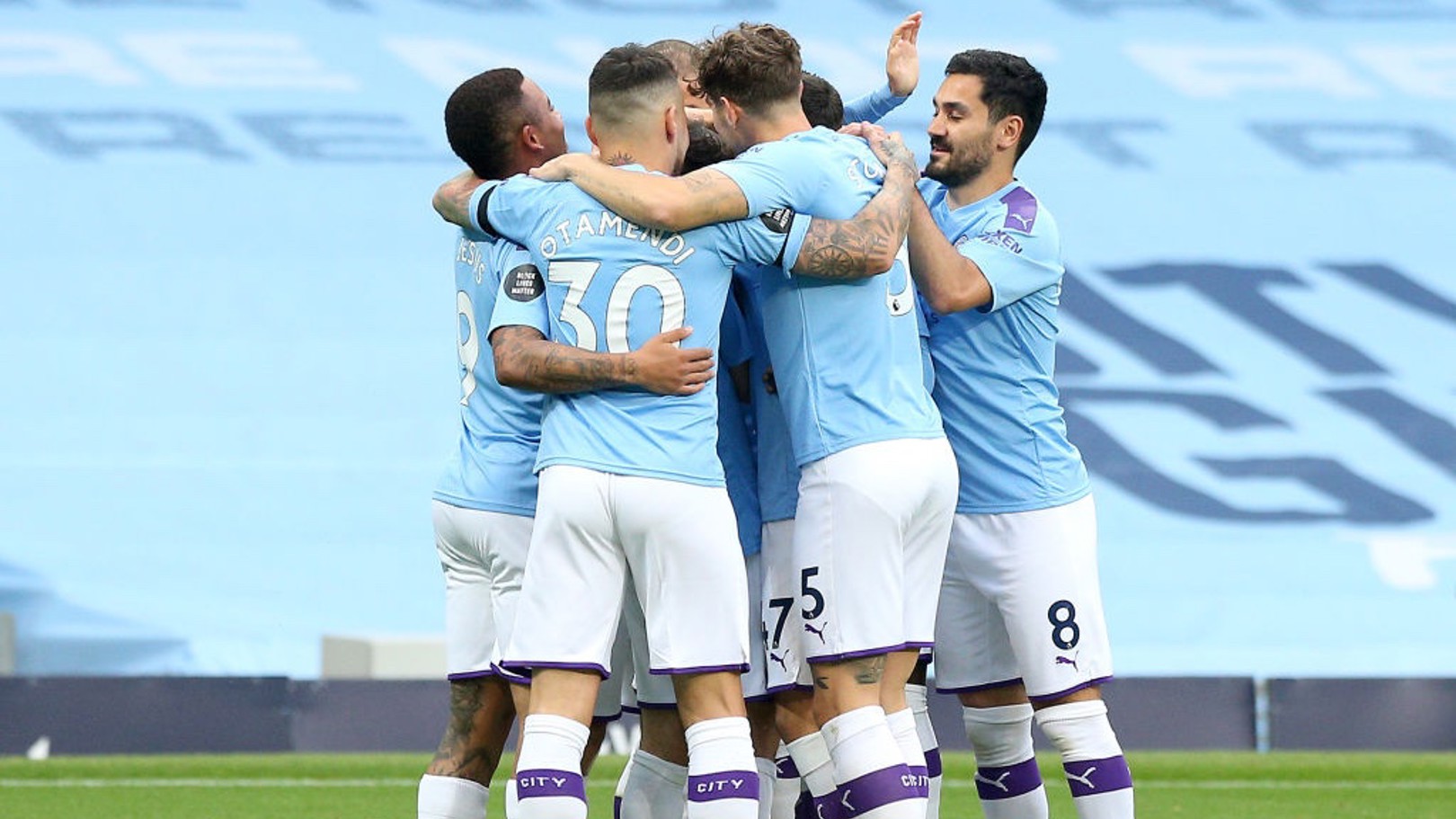 GROUP HUG: The players share the love after Silva's early goal.