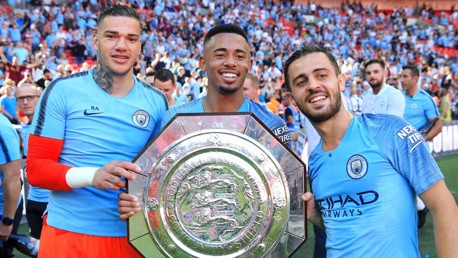 2018: Ederson, Gabriel Jesus and Bernardo Silva celebrate last season's Community Shield success.