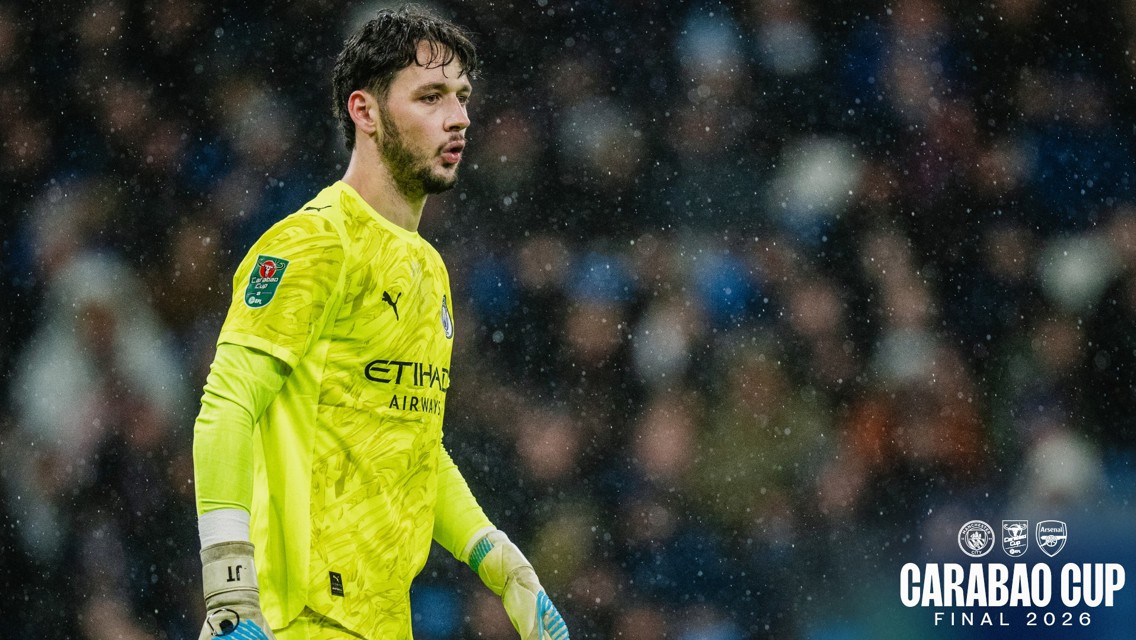 A Manchester City goalkeeper in a yellow kit during the Carabao Cup Final 2026 against Arsenal.