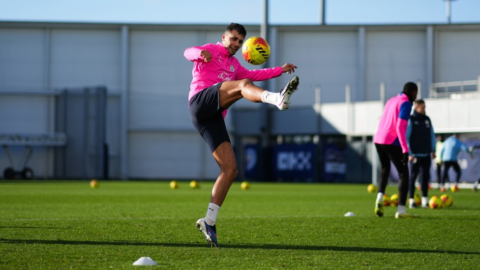 STRETCH FOR IT : Rodri brings the ball down