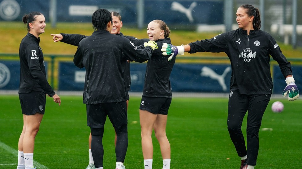 WHAT'S SO FUNNY?: Lily Murphy, Poppy Pritchard and Codie Thomas share a laugh during training