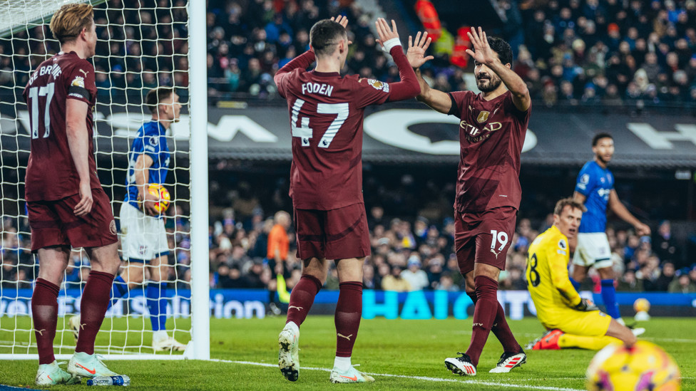 HIGH FIVE : Gundogan celebrates with Foden.