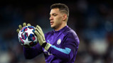 SAFE HANDS: Ederson warms the gloves before kick-off