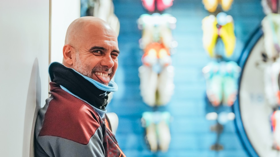 CHEEKY SIDE : Pep Guardiola spots the camera...