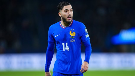 A soccer player wearing a blue France national team jersey with number 14 and the FFF emblem.