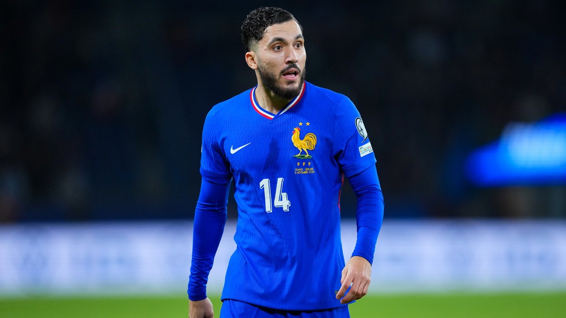 A soccer player wearing a blue France national team jersey with number 14 and the FFF emblem.