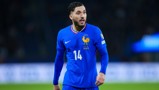 A soccer player wearing a blue France national team jersey with number 14 and the FFF emblem.