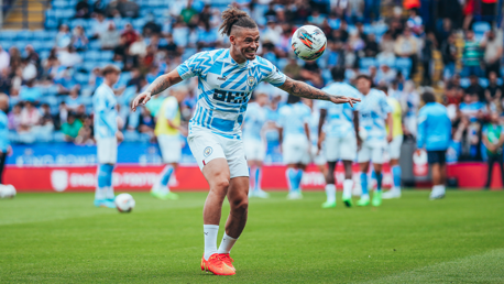 PHIL-ING IT: New signing Phillips gets a touch of the ball during the pre-match warm up.