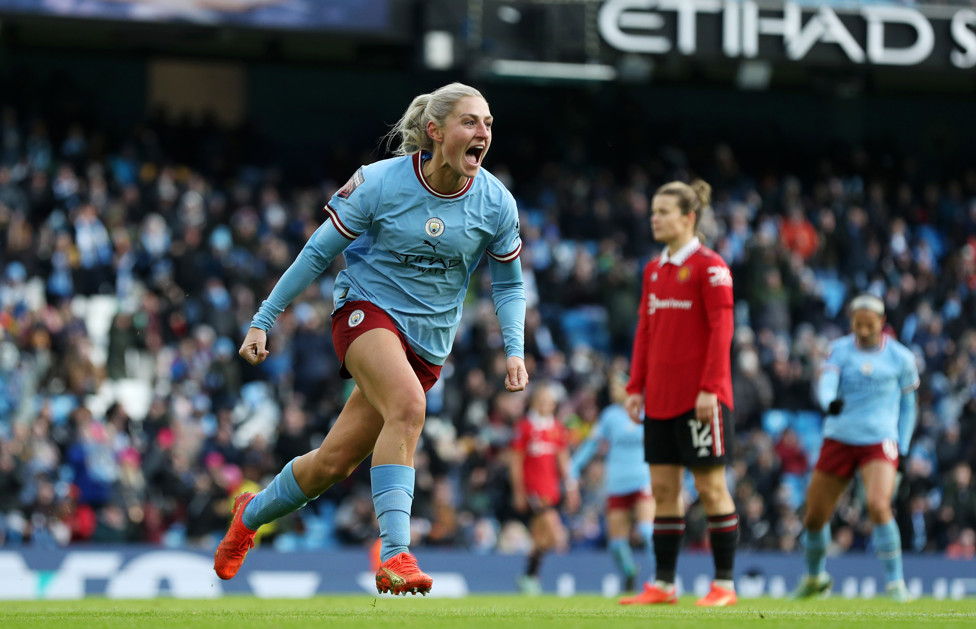 DERBY DELIGHT : Coombs heads home a vital equaliser in our record-breaking Etihad Stadium derby with Manchester United