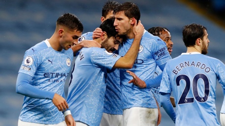 FESTIVE SPIRIT: The players share the love after Gundogan's composed finish.