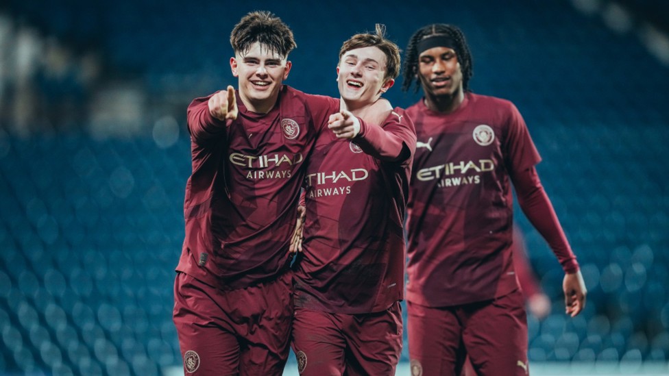 ALL SMILES: Finlay (centre) celebrates his second goal.