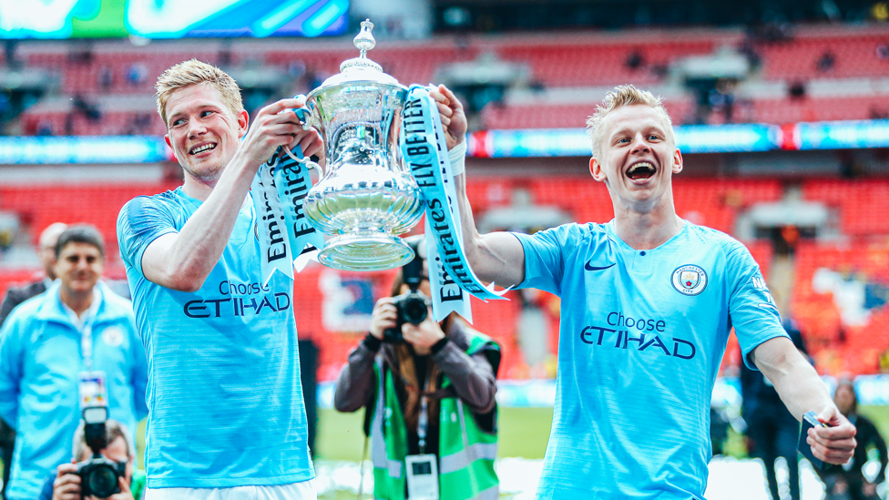 UP FOR THE CUP: Oleks and Kevin De Bruyne celebrate City's FA Cup final success over Watford in 2019