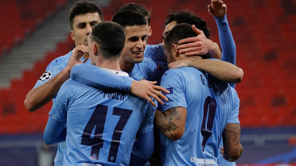 GROUP HUG : The players share the love after Jesus doubles the lead.