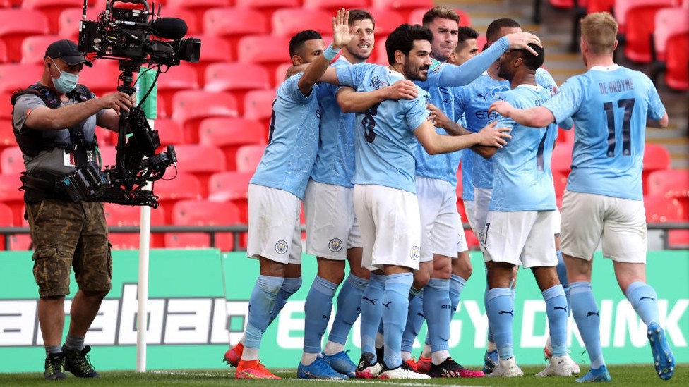 CENTRE OF ATTENTION : The players share the love after the crucial goal.