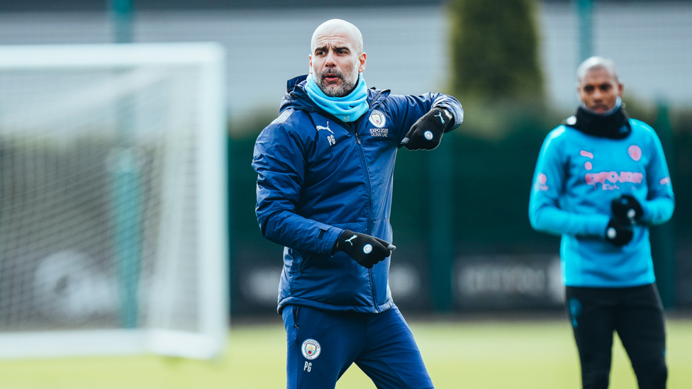 INSTRUCTING : Pep Guardiola gets to work.