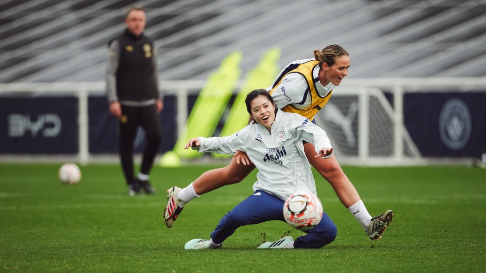BATTLING IT OUT: : Yui Hasegawa and Grace Clinton fight for the ball