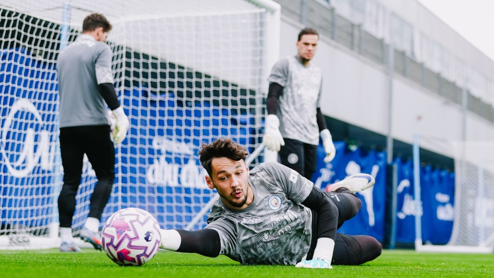 HE’S A KEEPER : James Trafford gets down low in training at the CFA